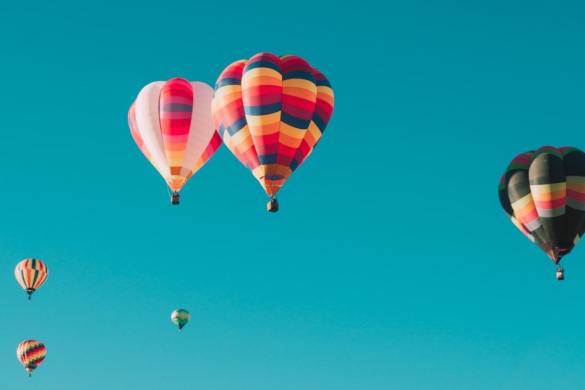 Luxury travel destination with crystal-clear water and overwater villas at sunset